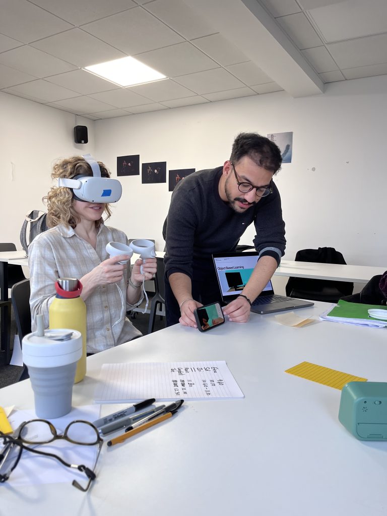Image of Ravin Raori and Lindsay Jordan (PG Cert Course Leader) during Microteaching Session. Lindsay is working in Virtual Reality while Ravin is live streaming what she sees for the rest of the participants.